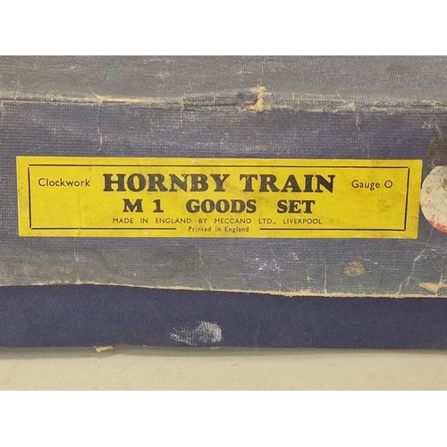 255 - Hornby vintage clockwork M1 Goods train set boxed includng key. Locomotive does run when wound but n... 