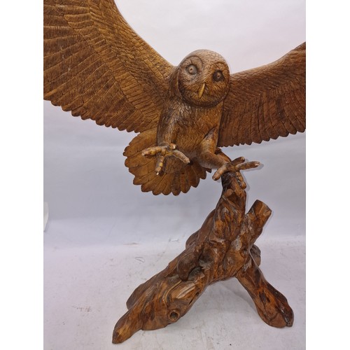 182 - Very large carved wooden figurine of an owl with outstretched wings inspect 93cm wingspan 78cm tall.