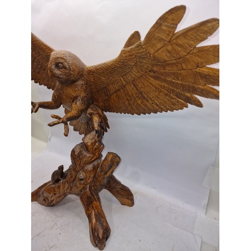 182 - Very large carved wooden figurine of an owl with outstretched wings inspect 93cm wingspan 78cm tall.