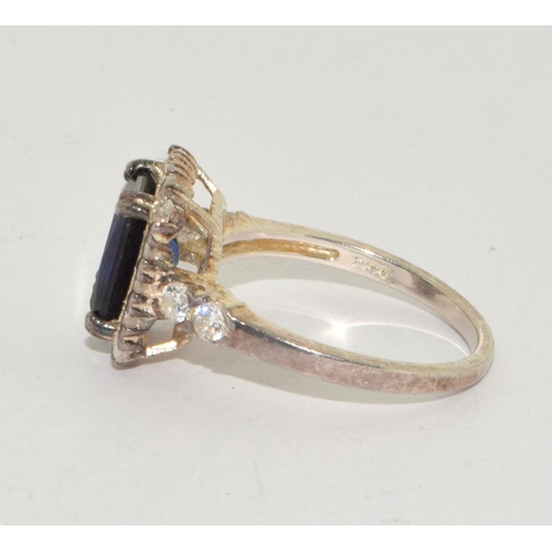 183 - A 925 silver CZ and blue stone dress ring Size O