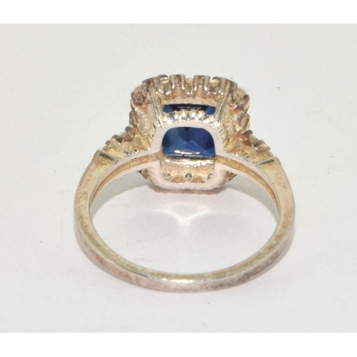 183 - A 925 silver CZ and blue stone dress ring Size O