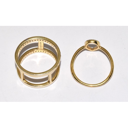 175 - Two modernist CZ gold on 925 silver rings size P 1/2 and R 1/2.