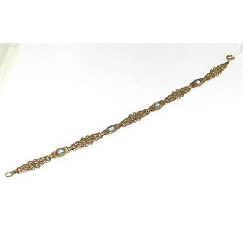 188 - A 9ct Gold Ladies Fancy Link Aquamarine Bracelet. ref W