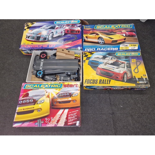 219 - Quantity of Scalextric track and controllers to include cars