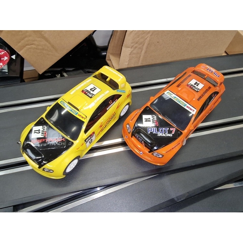 219 - Quantity of Scalextric track and controllers to include cars