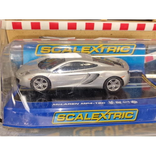 220 - Quantity of Scalextric track and controllers to include a car