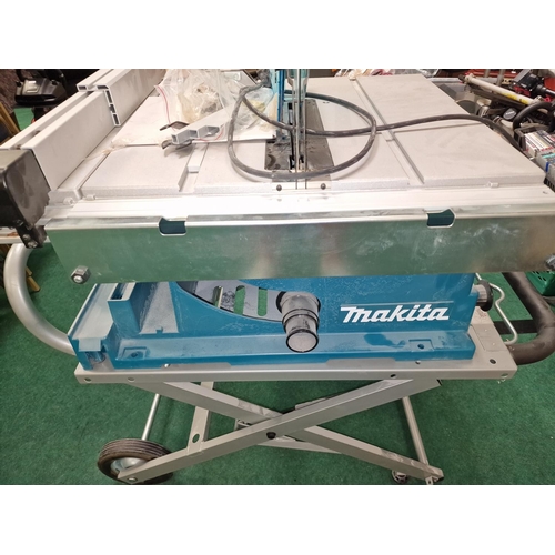 331 - Makita 2704N table saw with Makita branded stand in brand new unused condition.