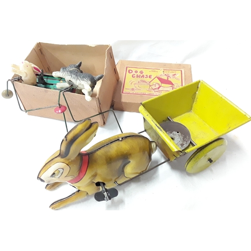 477 - Dog Chase (Japan) tinplate wind up toy in box together with British made tinplate Rabbit pulling a c... 