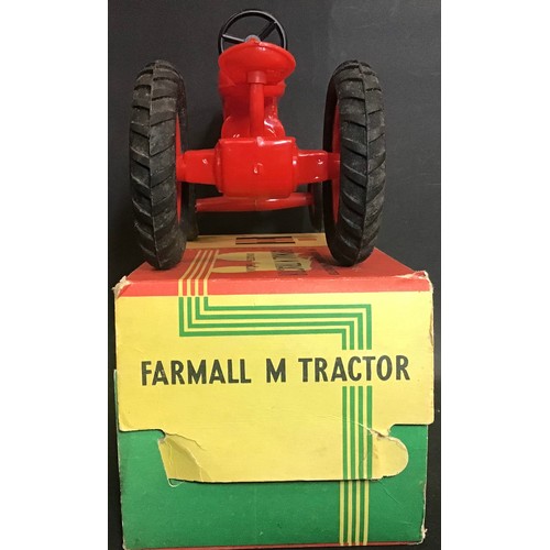 229 - Plastic model Toy Farmall Diesel Tractor complete with original box.