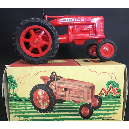 229 - Plastic model Toy Farmall Diesel Tractor complete with original box.