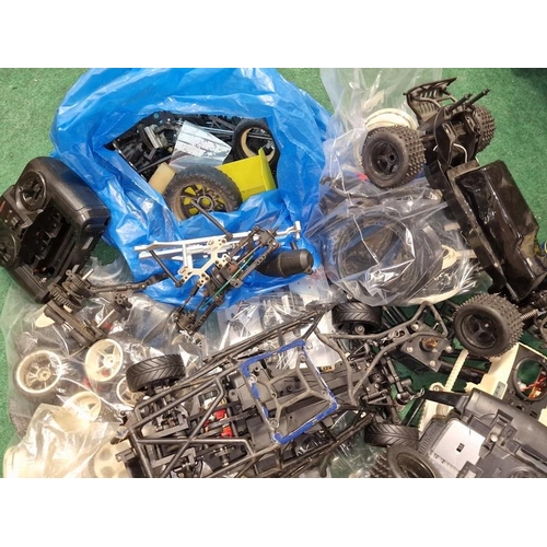 234 - Large collection of Remote Controlled car spare parts to include shells, engines, controllers etc. C... 