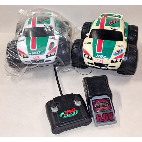 236 - Nikko pair of NRT 598 R/C cars with a controller and battery charger.