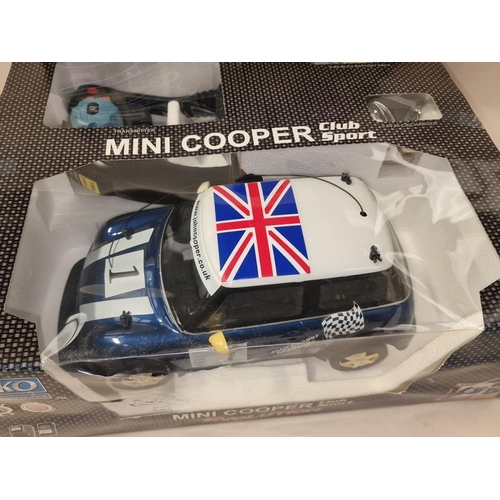 245 - Nikko Mini Cooper Sport Evolution boxed radio controlled car.