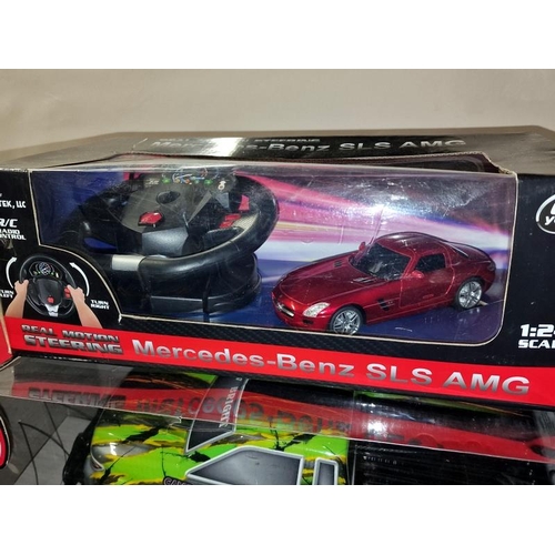 250 - New bright Trail Ghost boxed radio controlled truck together with a boxed Mercedes-Benz SLS AMG radi... 