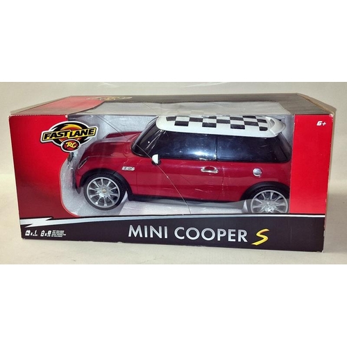 251 - Fast Lane boxed radio controlled Mini Cooper S car together with a vintage unboxed radio controlled ... 