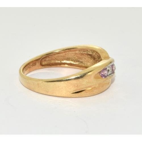 356 - 9ct gold ladies diamond and Pink Tourmaline cross over ring size M