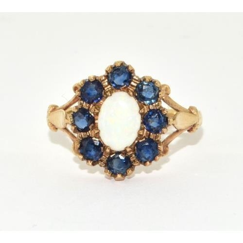 298 - 9ct gold ladies Opal and sapphire cluster in the halo design size N