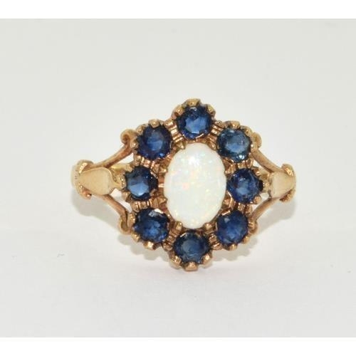 298 - 9ct gold ladies Opal and sapphire cluster in the halo design size N