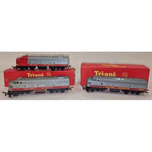 130 - Tri-ang Railways pair of OO Gauge Diesel Locos together with a dummy end. Two are boxed (3).