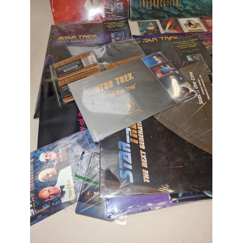 256 - Star Trek collection of collectable phone cards. Loose and in sets. Majority still sealed/unopened.