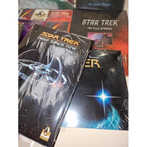 256 - Star Trek collection of collectable phone cards. Loose and in sets. Majority still sealed/unopened.