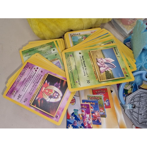 257 - Large collection of Pokemon related collectables, playing cards, toys etc together with a bag of pog... 