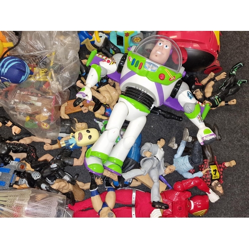 259 - Large collection of various action figures to include Toy Story and WWE Wrestlers.