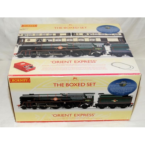 142 - Hornby 00 gauge 'Orient Express' The boxed set ref:R1038. Outer box opened but contents appear compl... 