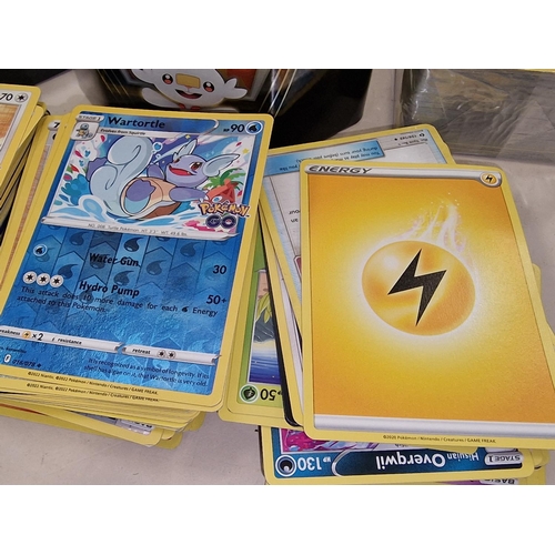 271 - Large collection of unsorted Pokemon trading cards to include a sealed pack. Good lot to sort throug... 