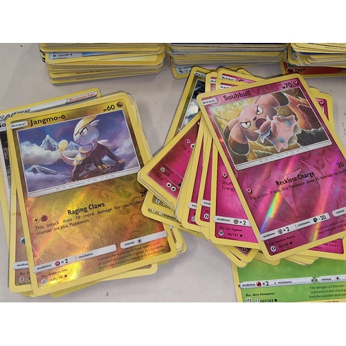 271 - Large collection of unsorted Pokemon trading cards to include a sealed pack. Good lot to sort throug... 