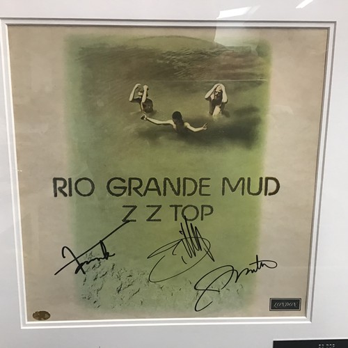 470 - ZZ TOP SIGNED VINYL FRAMED ALBUM. This professional 22” x 34” framed album of ‘Rio Grande Mud’ on De... 