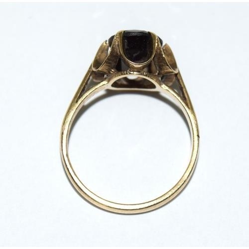 326 - 9ct gold Solitaire Garnet ring in a claw setting size N