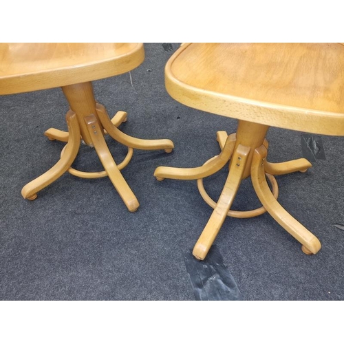 575 - A pair of elm swivel chairs.