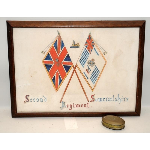 119 - Framed pen and ink depicting the colours of the Second Somersetshire Regiment, c/w a trench art toba... 