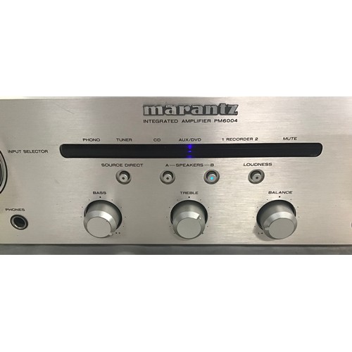 579 - MARANTZ STEREO AMPLIFIER. This is model No. PM 6004 and powers up when plugged in.