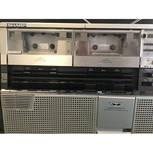 598 - SHARP GHETTO BLASTER. This is model No. GF-555 and has a double cassette deck / Radio which powers u... 