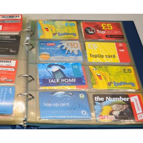 173 - Very large collection of phone cards contained within 2 albums. 100's of cards well worth a sort thr... 