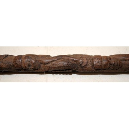 236 - Two early African carved hardwood walking canes, each around 85cms long