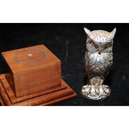 262 - Hallmarked sterling silver Owl mounted on a wooden stepped plinth. Not filled 137g silver weight, o/... 