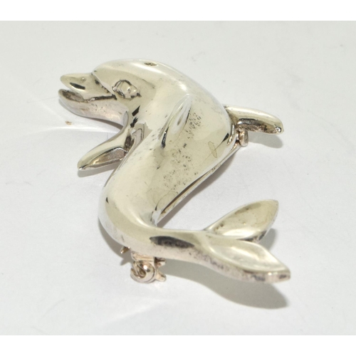 396 - A large heavy weigh solid 925 silver dolphin brooch.