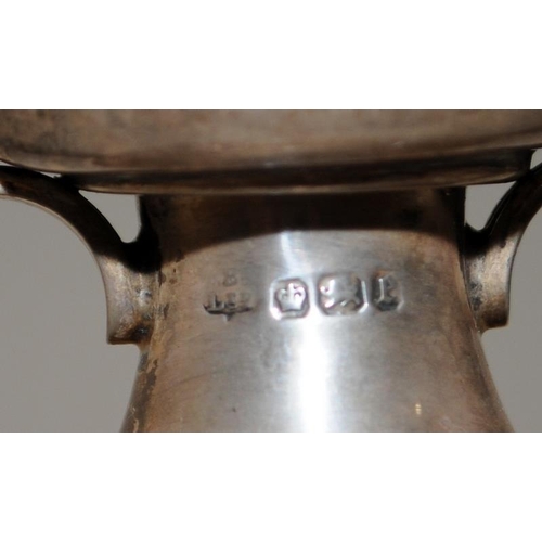 352 - Hallmarked silver twin handled urn 13.5cms tall. Hallmarked for Sheffield 1897. total weight 284g wi... 