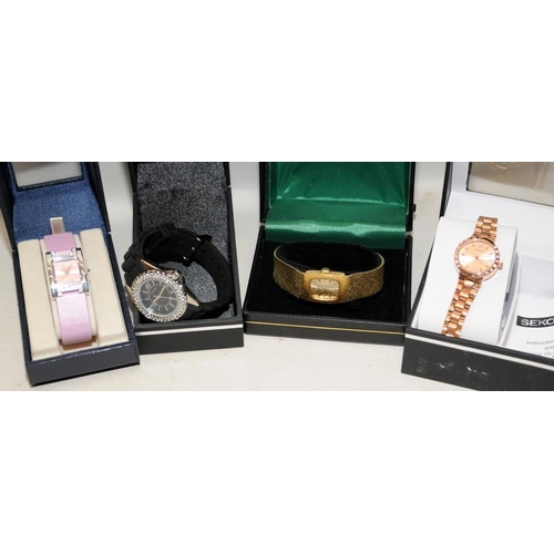 347 - Collection of boxed ladies fashion watches