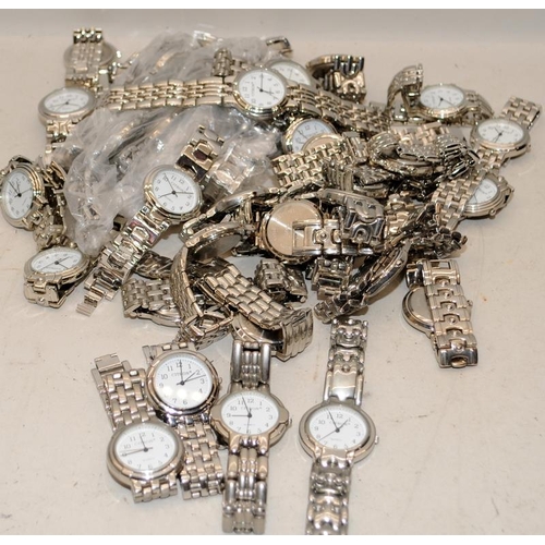 332 - Large collection of mid size quartz watches. All unworn and requiring new batteries fitting. 34mm ac... 