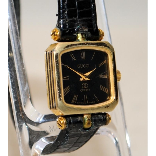 297 - Ladies Gucci quartz watch ref: 4.86. Black dial square cushion case. Untested, requires new battery ... 