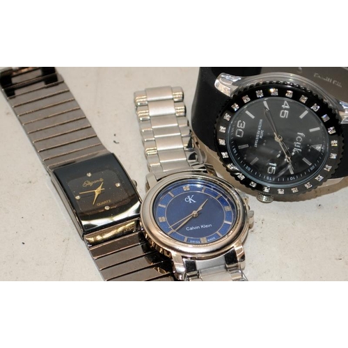 359 - A collection of gents quartz fashion watches. Rotary, Armani, Diesel etc. Some are working and other... 