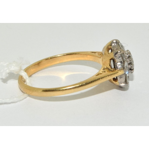 318 - 18 ct gold ladies Diamond daisy ring as VS1/SI1 0.65ct size L