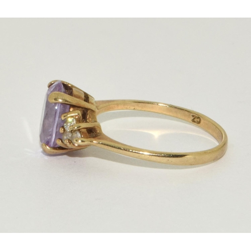 301 - 9ct gold ladies Amethyst ring size O