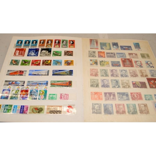 190 - Five stamp albums, two with a good selection of world stamps including early examples, an album of D... 