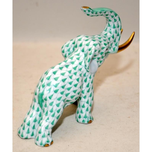 217 - Herend porcelain green fishnet elephant with 24ct gilded accents. 12.5cms across