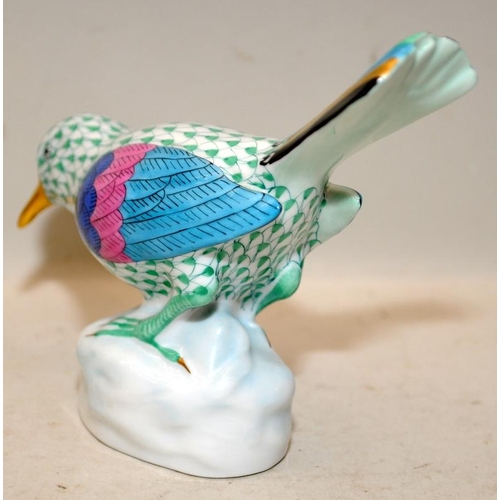 218 - Herend porcelain green fishnet bird perched on a rock. with 24ct gilded accents. 14cms across